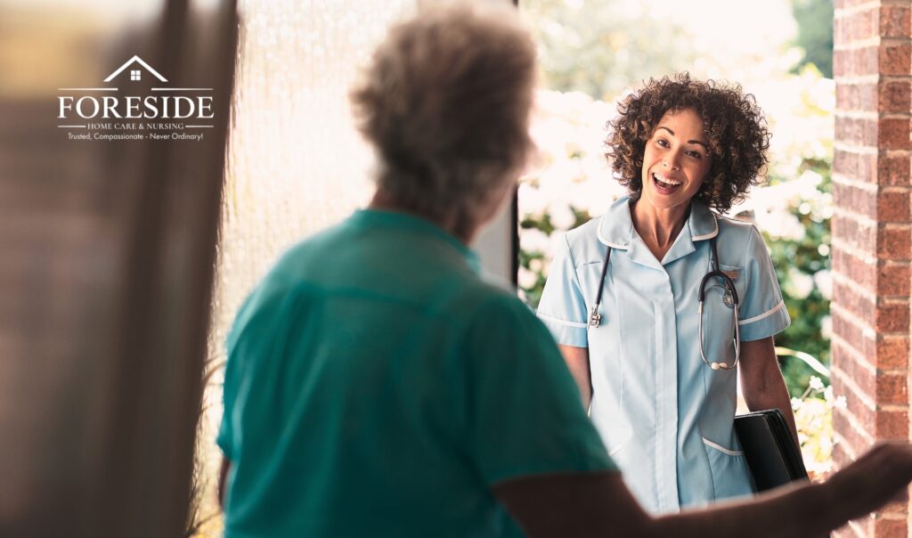 Nurse visiting elderly woman at home entrance.