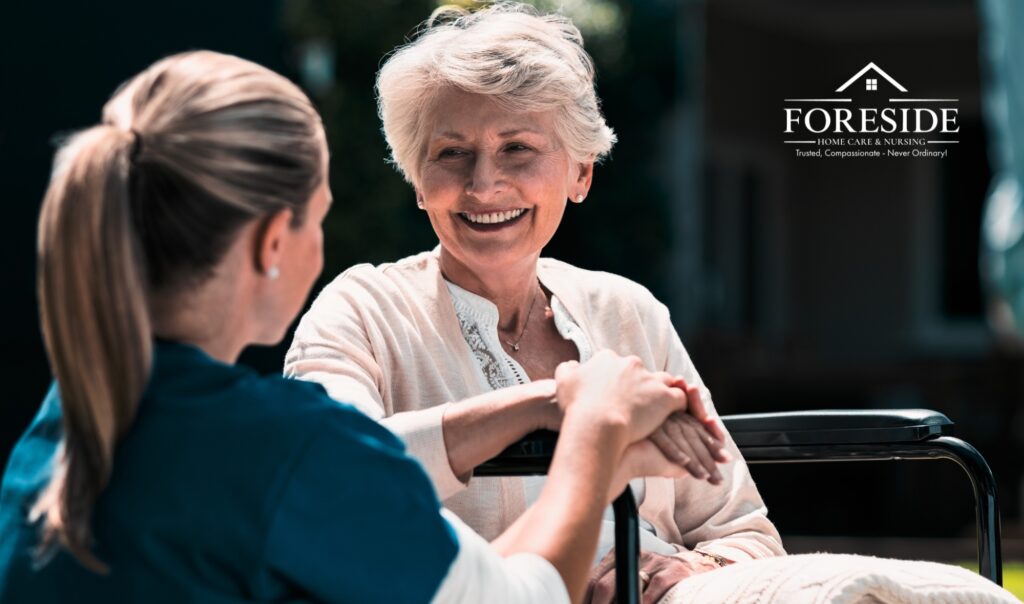 Smiling caregiver with elderly woman, Foreside Home Care logo.