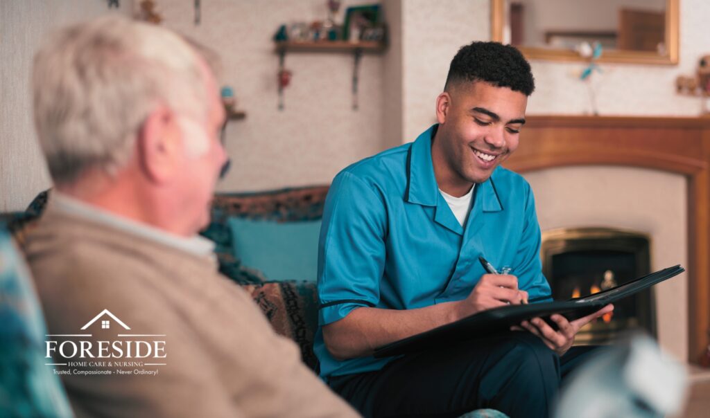 Caregiver assisting elderly man in cozy living room.