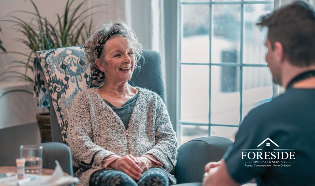 Elderly woman smiling during home care visit