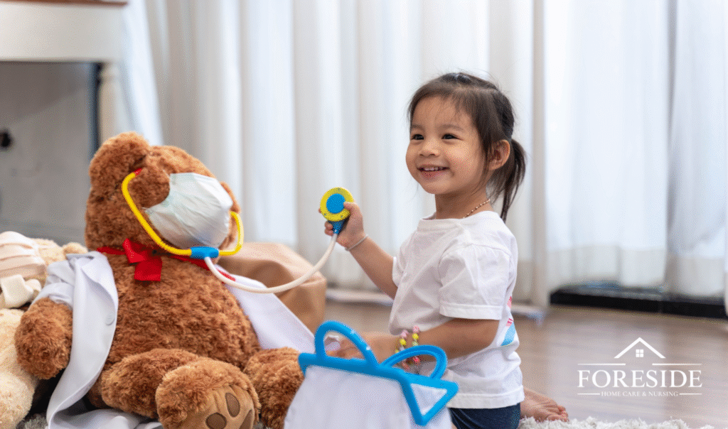 Child plays doctor with teddy bear toy.