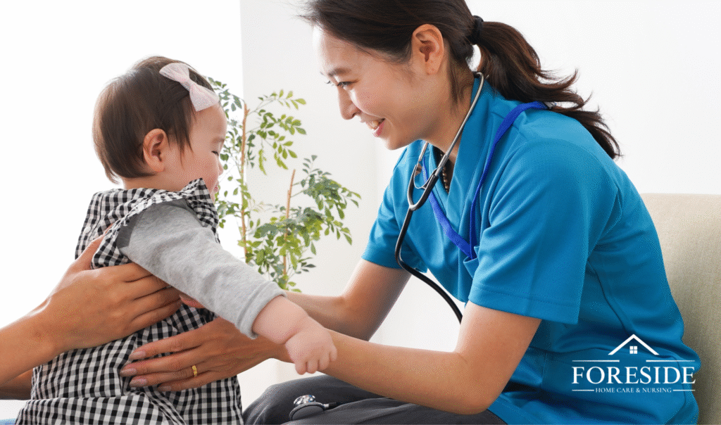 Nurse smiling at child during checkup.