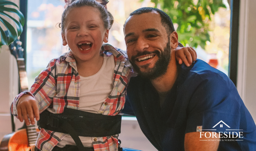 Smiling nurse with laughing child in wheelchair.