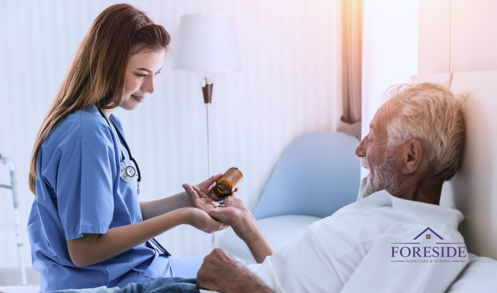 Nurse gives medication to elderly man in bed.